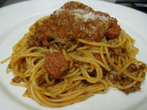 Filipino spaghetti with hot dogs, beef and pork.